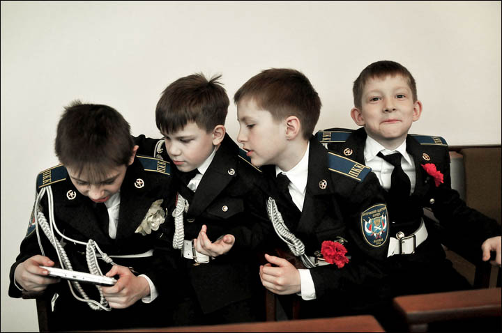 Boys cadets playing video game