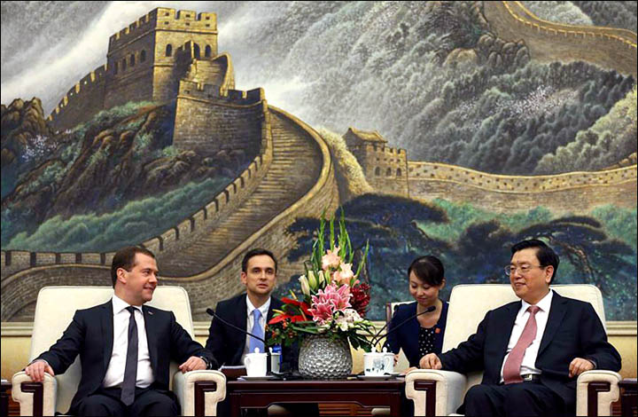 More than 20 new deals on energy, investment and education are inked in Beijing . 