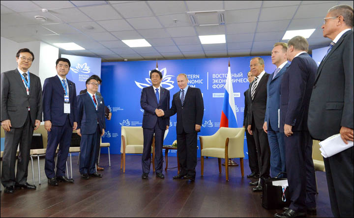 Vladimir Putin meets Shinzo Abe