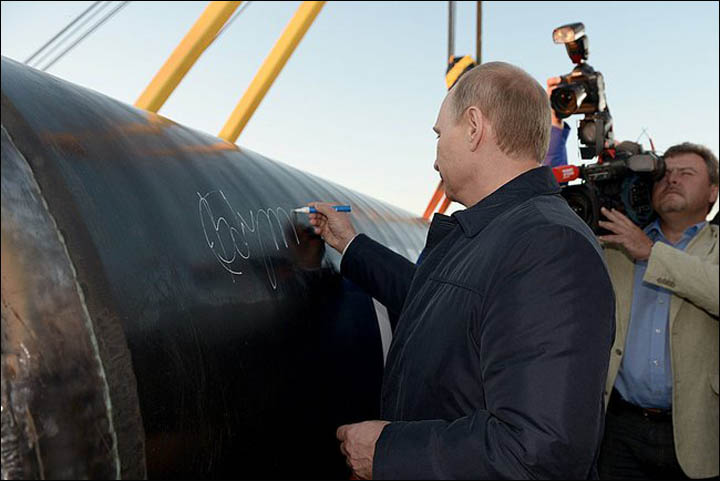 Putin puts his signature
