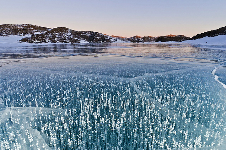 Teeing off for golf contest on frozen surface world’s deepest lake