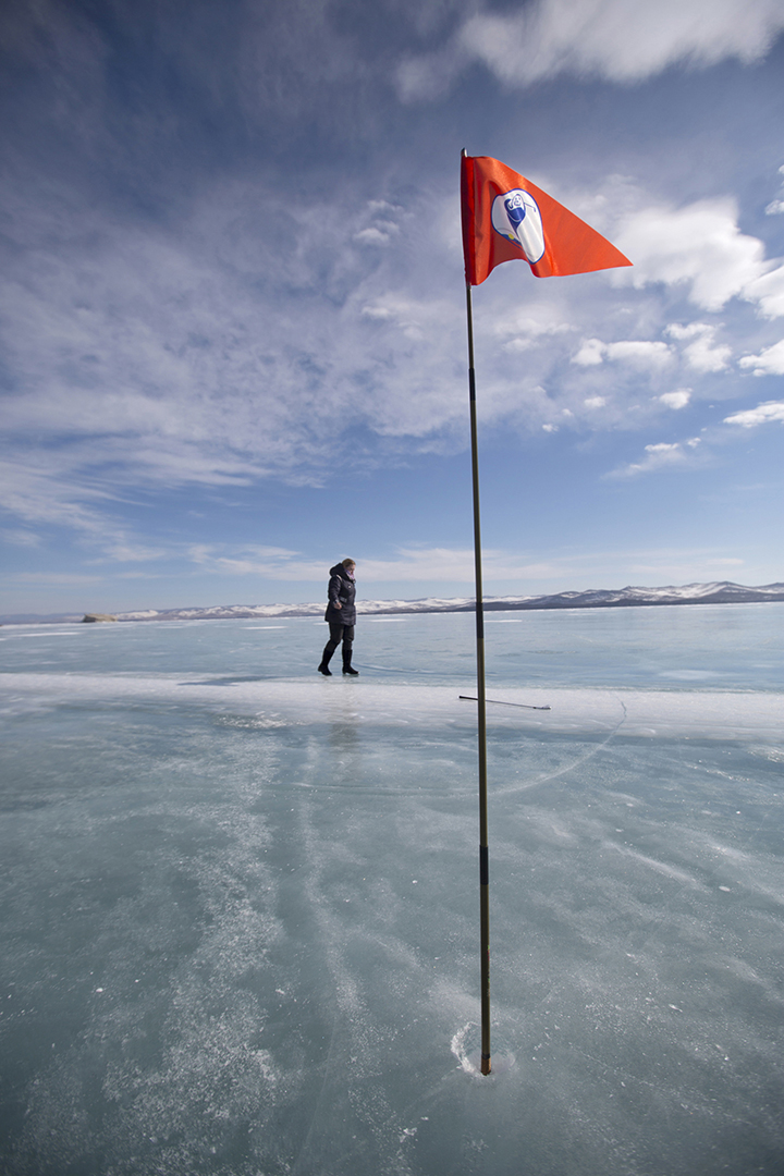 Teeing off for golf contest on frozen surface world’s deepest lake