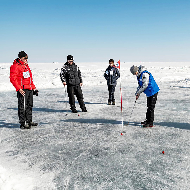 Teeing off for golf contest on frozen surface world’s deepest lake