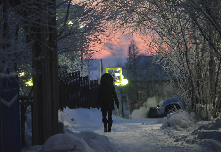 Girl walking along the street 
