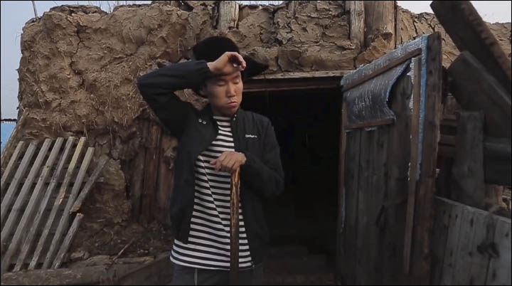 Boy near the cowshed