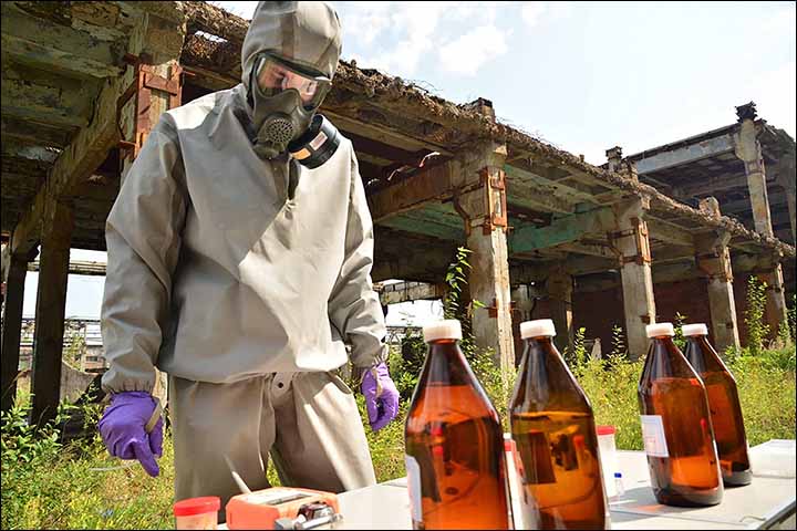 Military experts work at the site