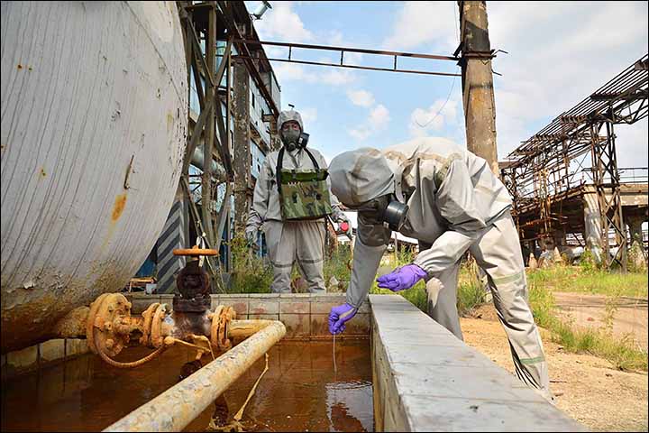 Military experts work at the site