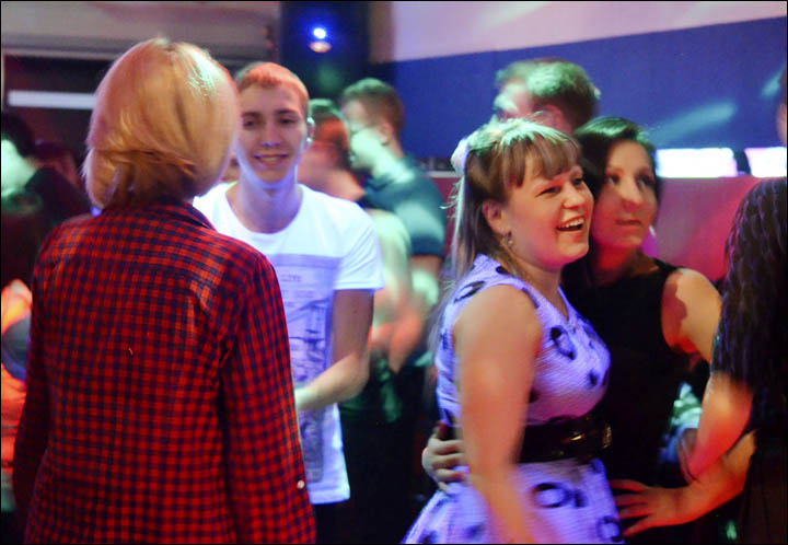 Young people dancing in the night club