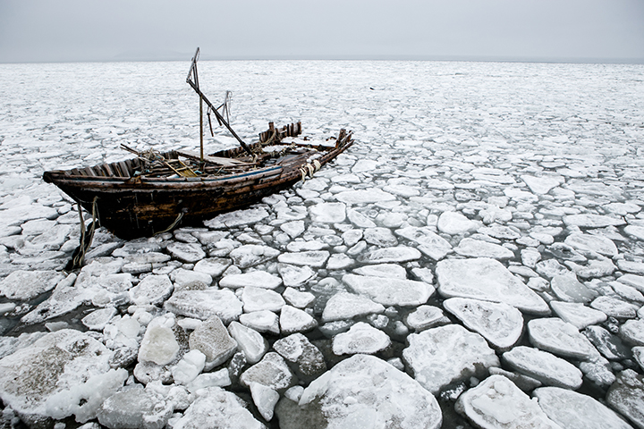 Photographer captures eerie graveyard of North Korean schooners scattered along the Russian coast