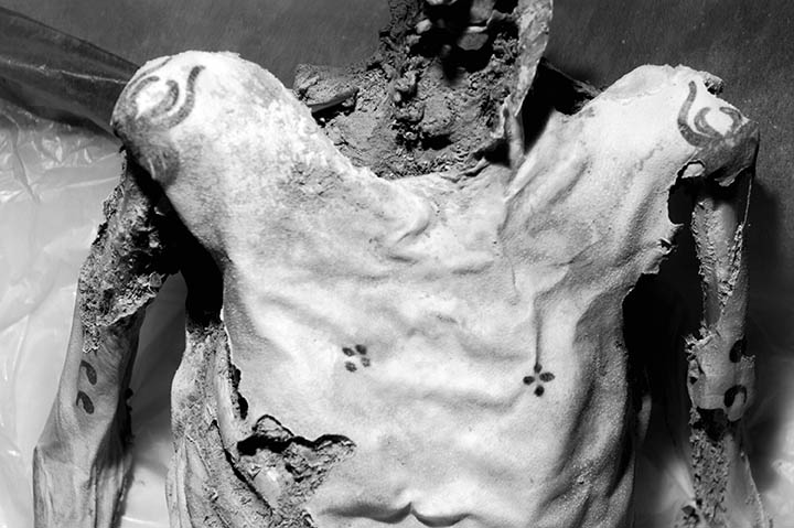 Tattoos on the male's chest