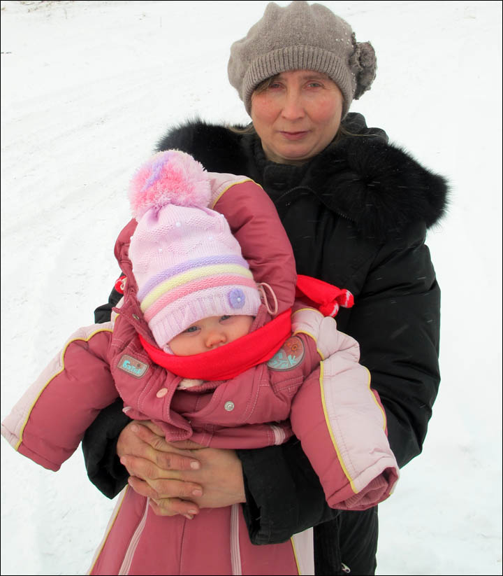 British baby enjoys her first sleigh rides in remote Siberian village where she is being raised 