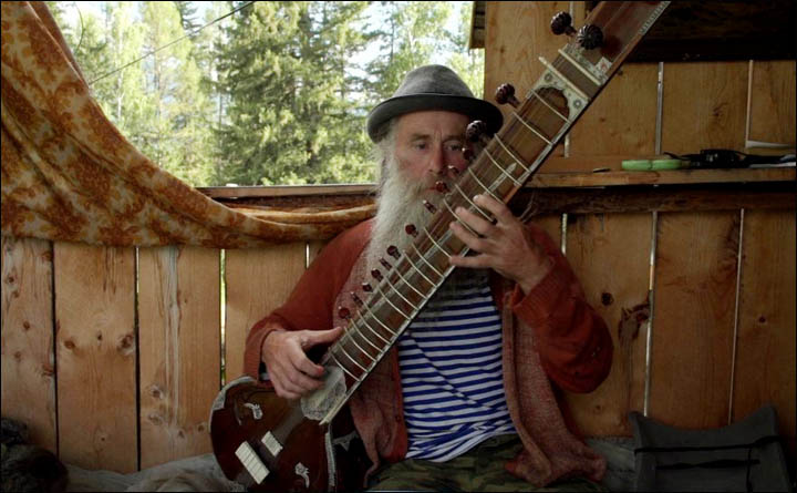 Old musician with sitar