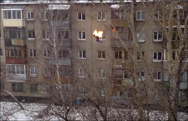 Teenager is set on fire before diving five floors into pile of snow.  