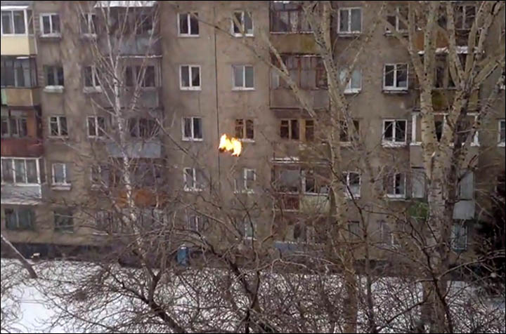 Teenager is set on fire before diving five floors into pile of snow.  